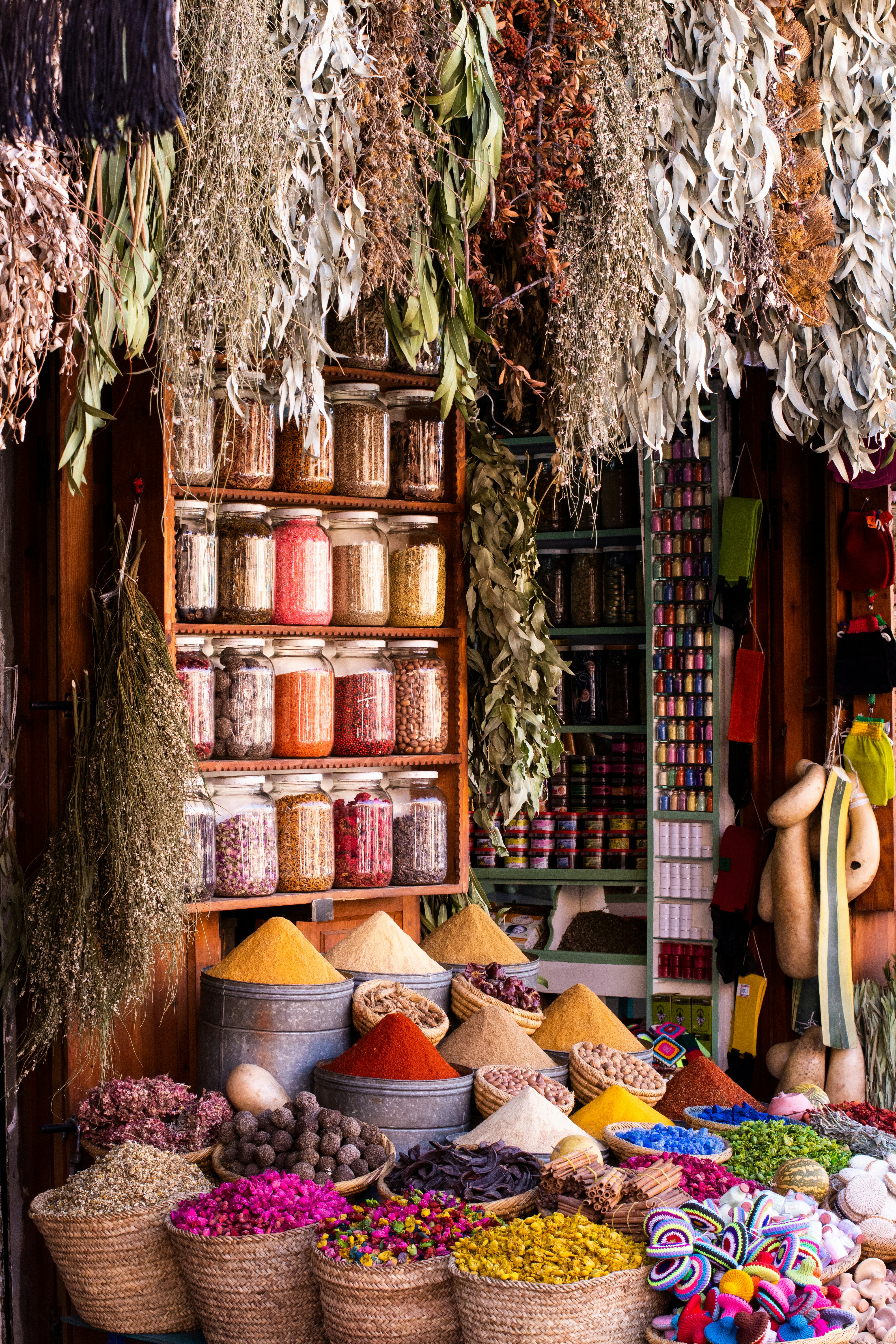 A colorful array of Indian spices in traditional bowls