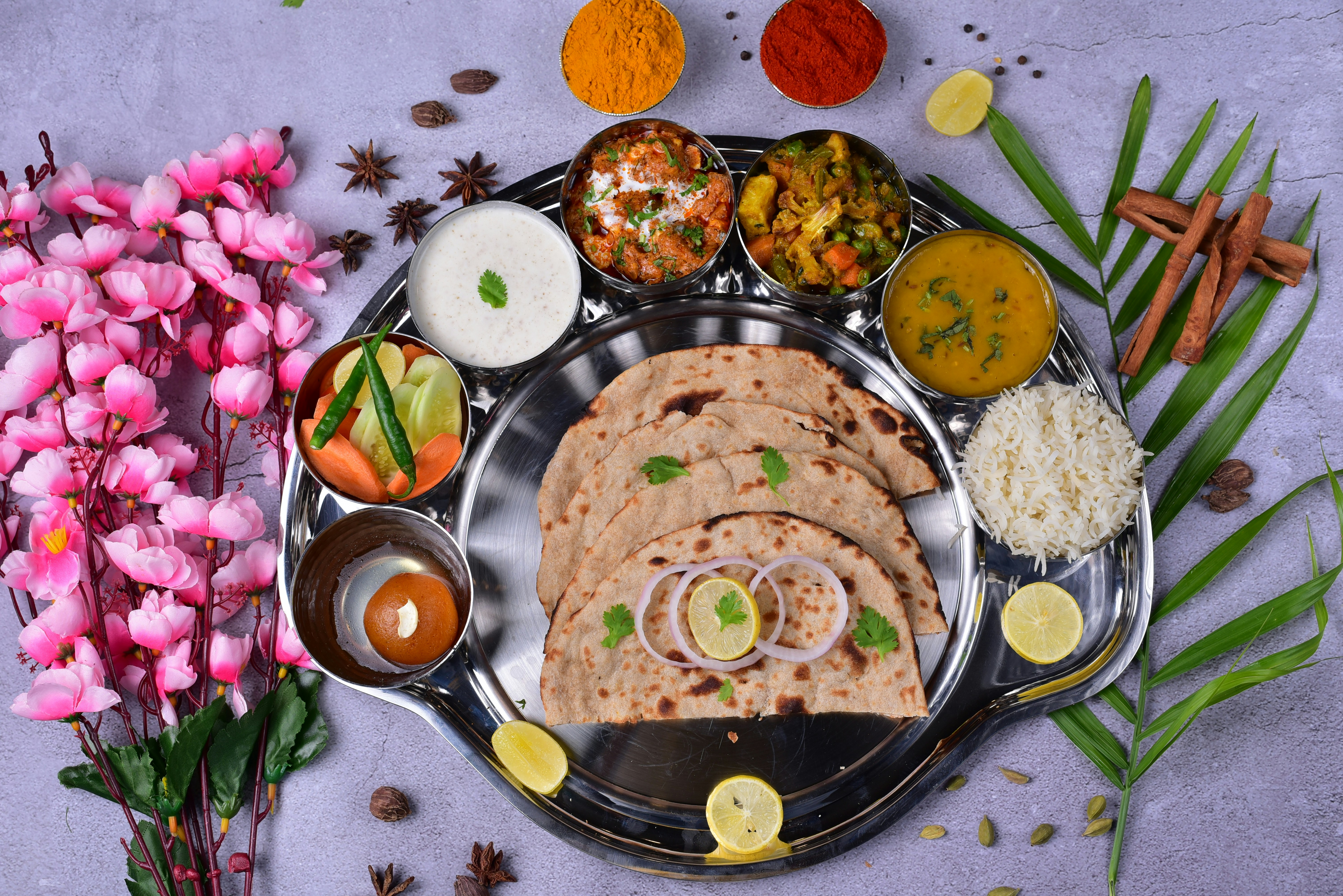 A traditional Indian thali with various dishes